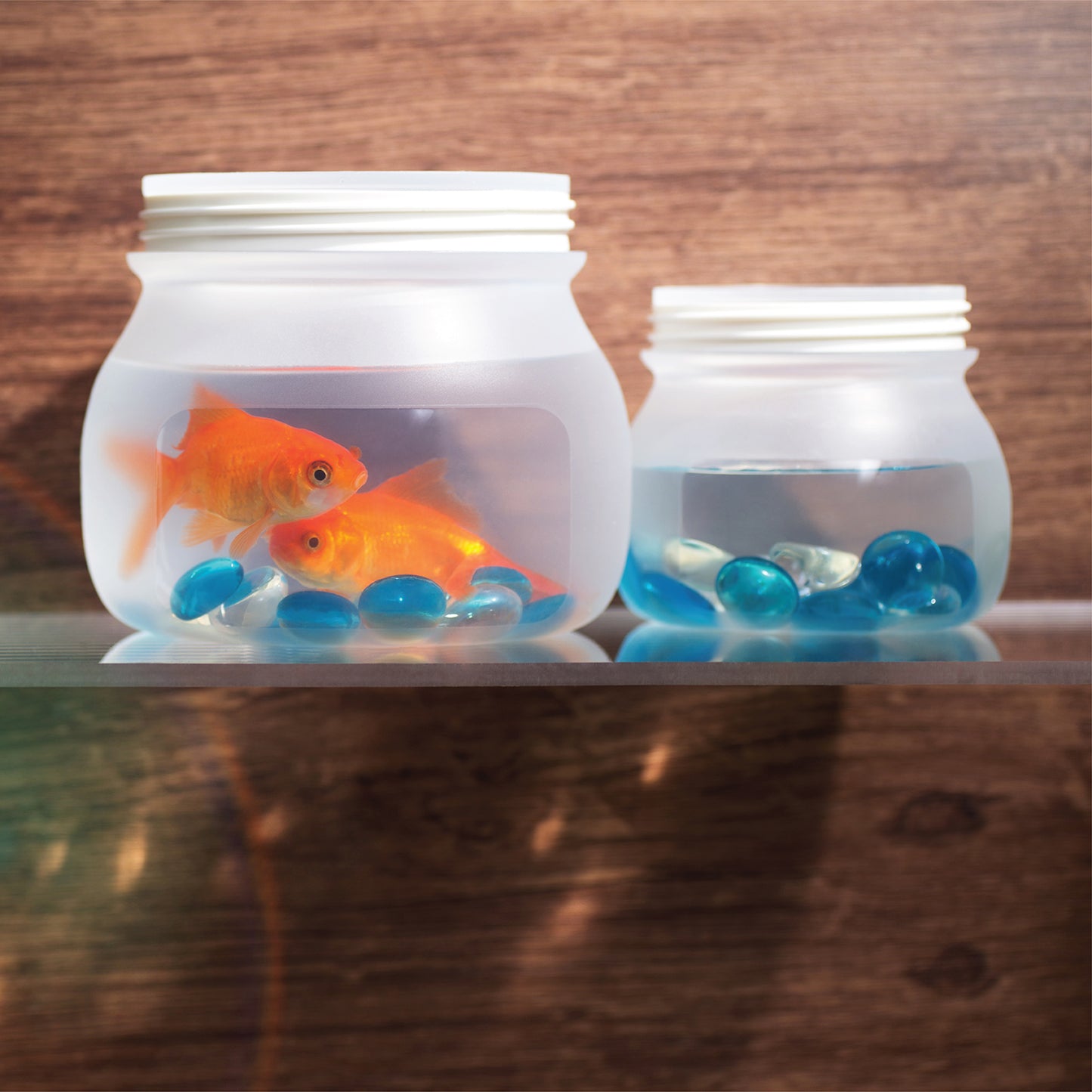 Silicone jars filled with fish and water