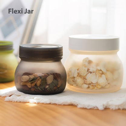 Two silicone jars (one filled with popcorn and another with nuts)