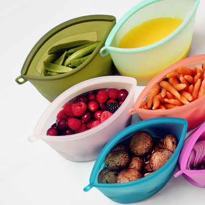 Silicone food storage bags filled with various foods