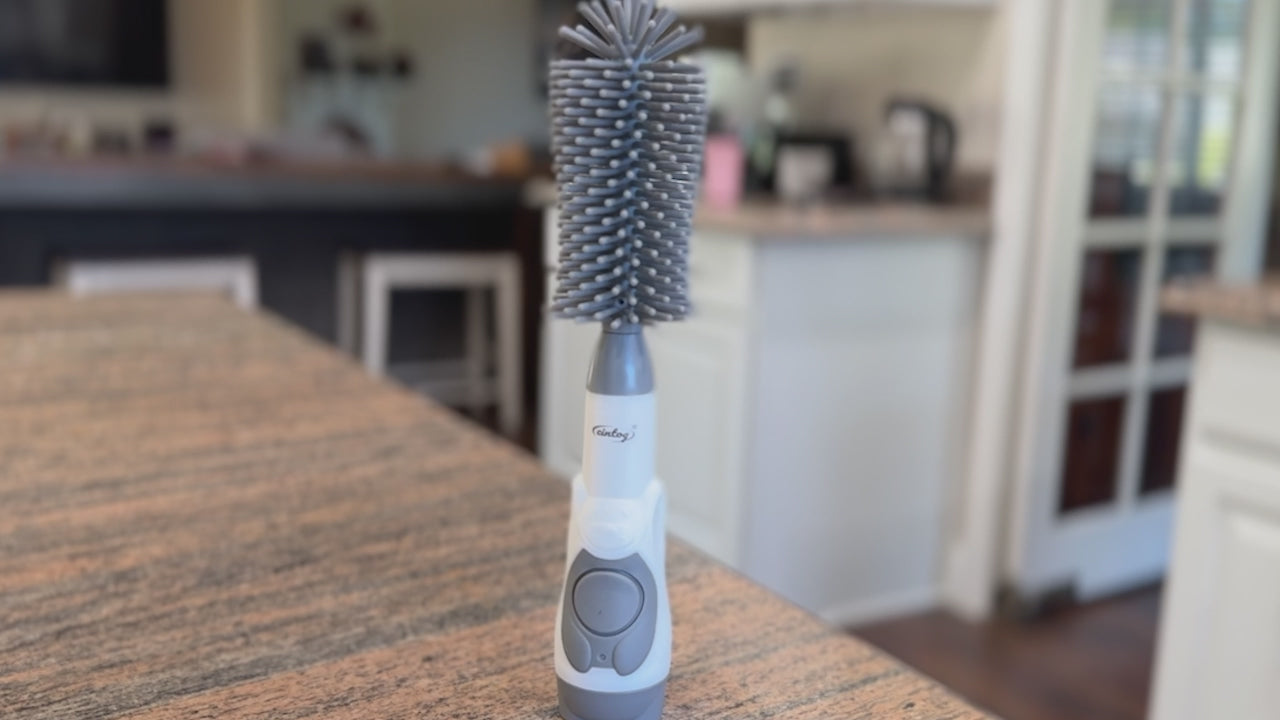 Product overview of a soap dispensing bottle brush